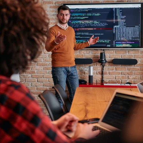 in-a-corporate-setting-businessman-leads-a-meeting-2025-01-15-16-21-02-utc